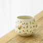 金彩レリーフカップ　オレンジ x 薄緑｜荒井彩乃