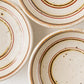赤絵と鉄絵の線がお料理を引き立たせてくれる冨本大輔さんの灰釉絵付3寸皿